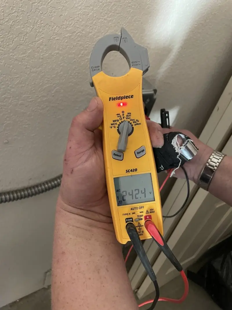 Voltage testing with clamp meter during Electrical Installation Services in Notre Dame